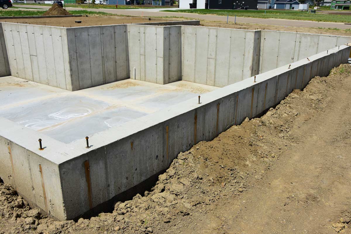 homeguide-concrete-basement-foundation-poured-and-ready-for-lumber